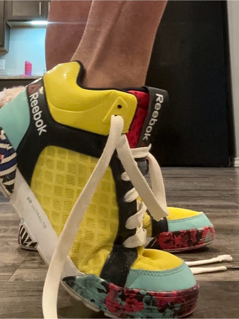 Women’s Reebok Yellow, Aqua & Pink High-Top Sneakers Colorful high-tops.